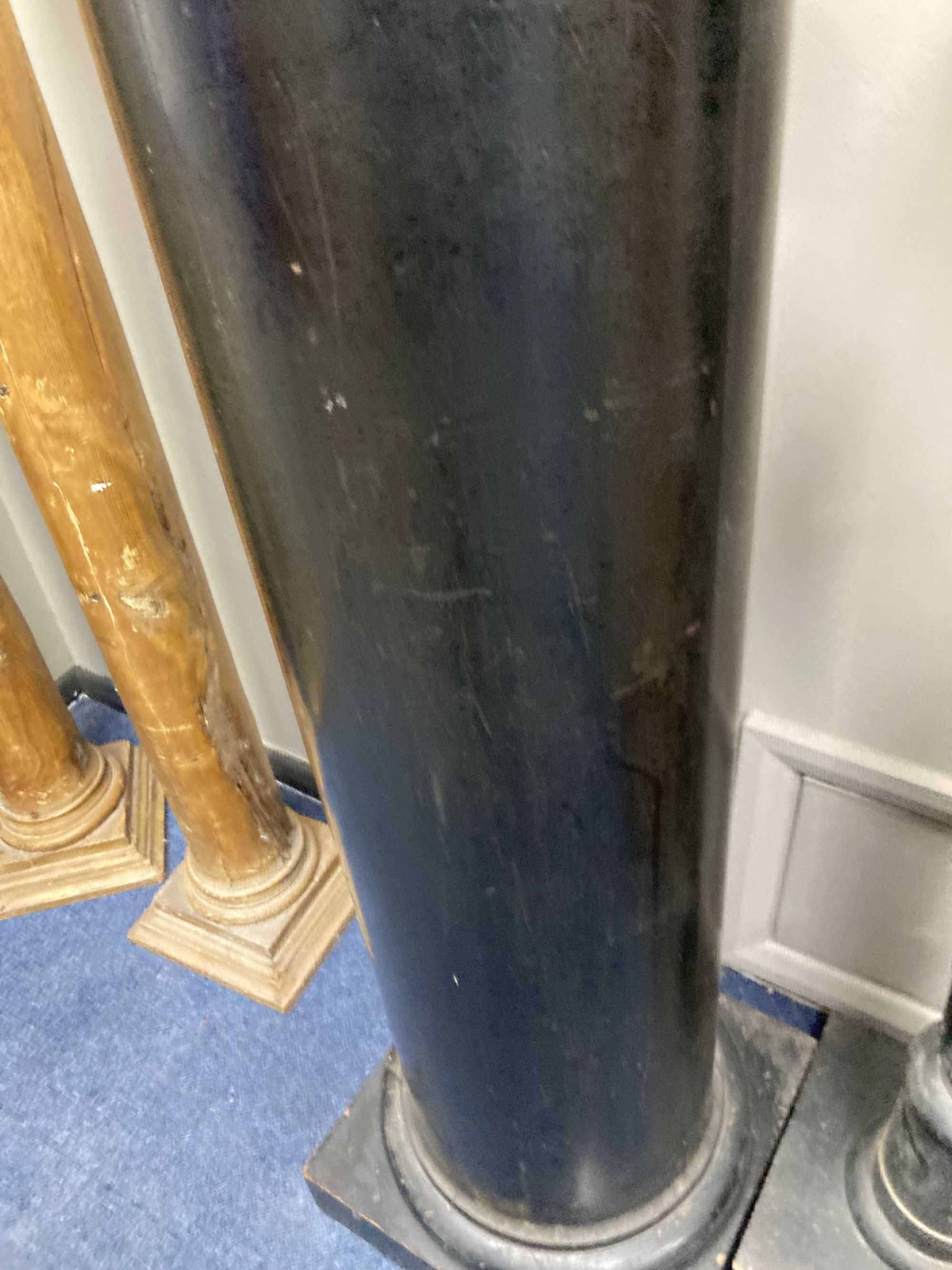 An ebonised wood column, height 99cm